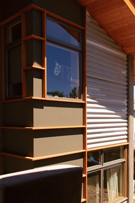 
Their home, made of corrugated cementitious panels and Hardiplank fiber-cement exterior siding, uses a large percentage of recycled material.
